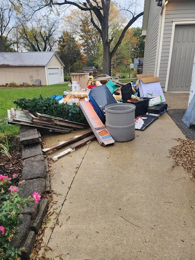 Dumpster being loaded with debris for Estate Cleanout Dumpster Rental in East Lampeter